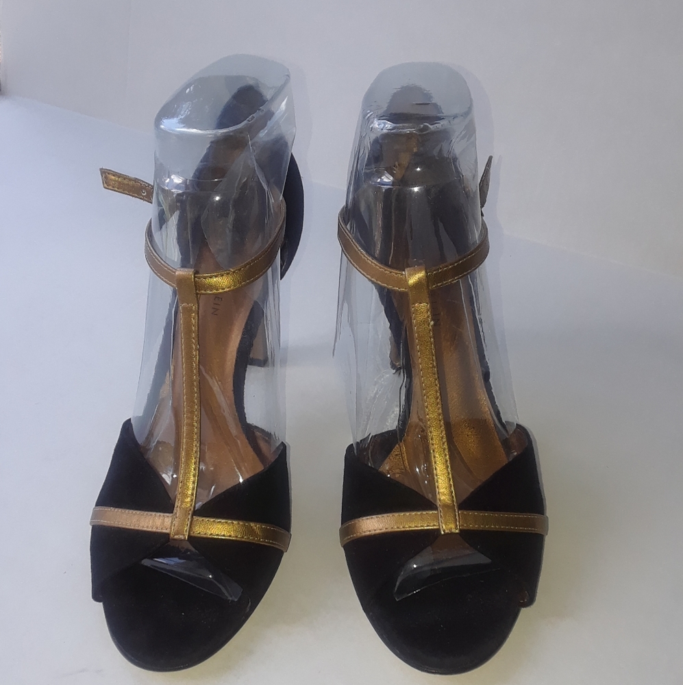 Black and gold suede heels.